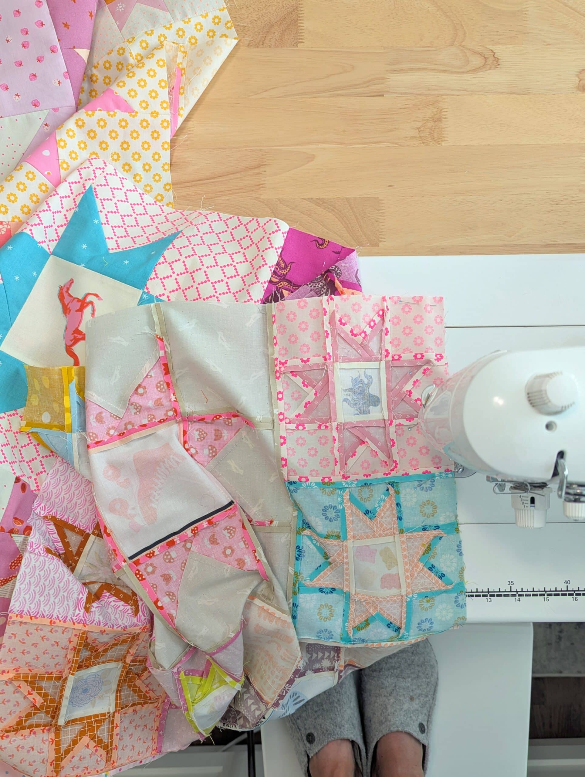 Overhead view of sewing machine stitching last seam.