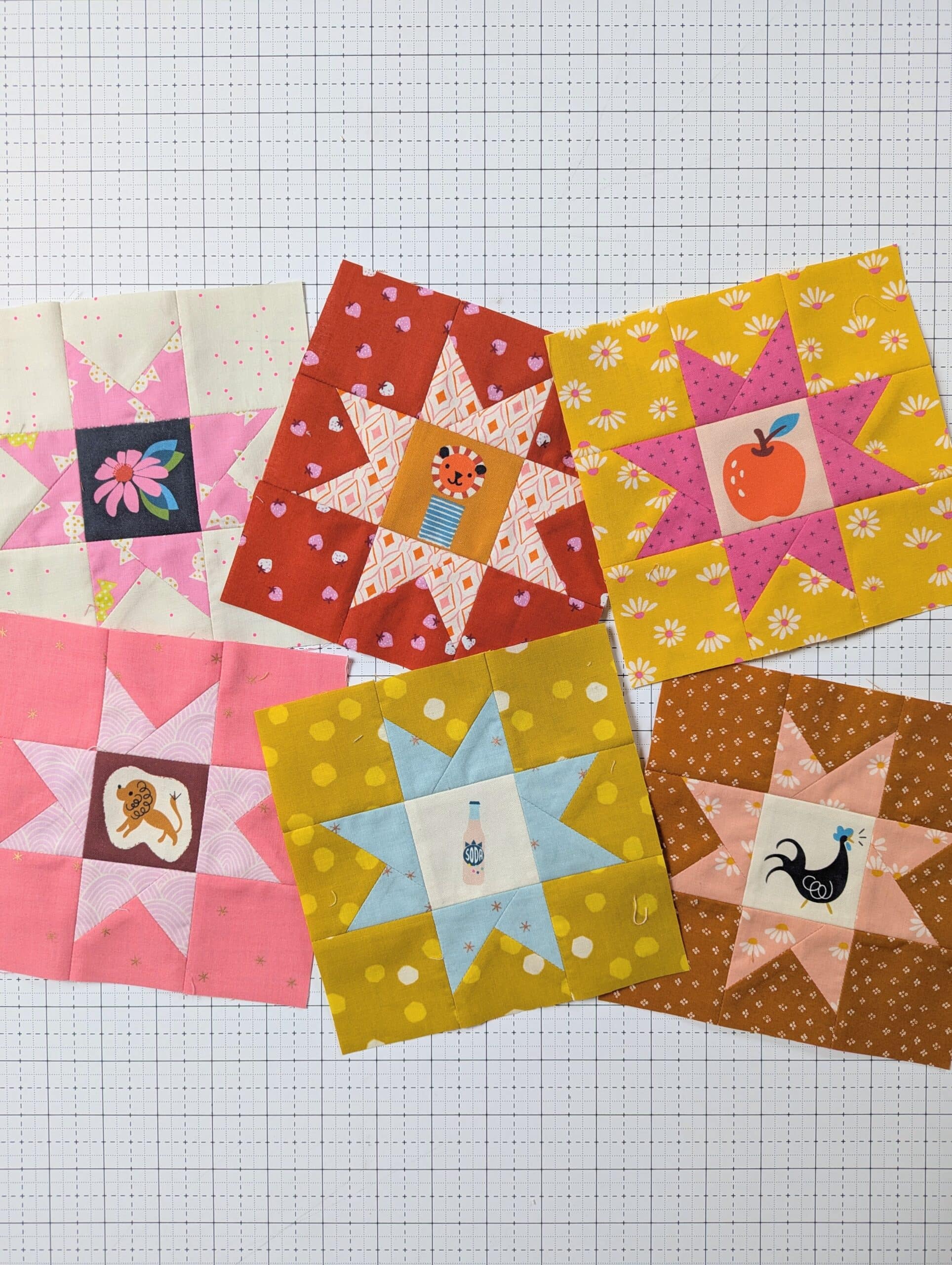 Colourful quilt blocks lay on a cutting mat.