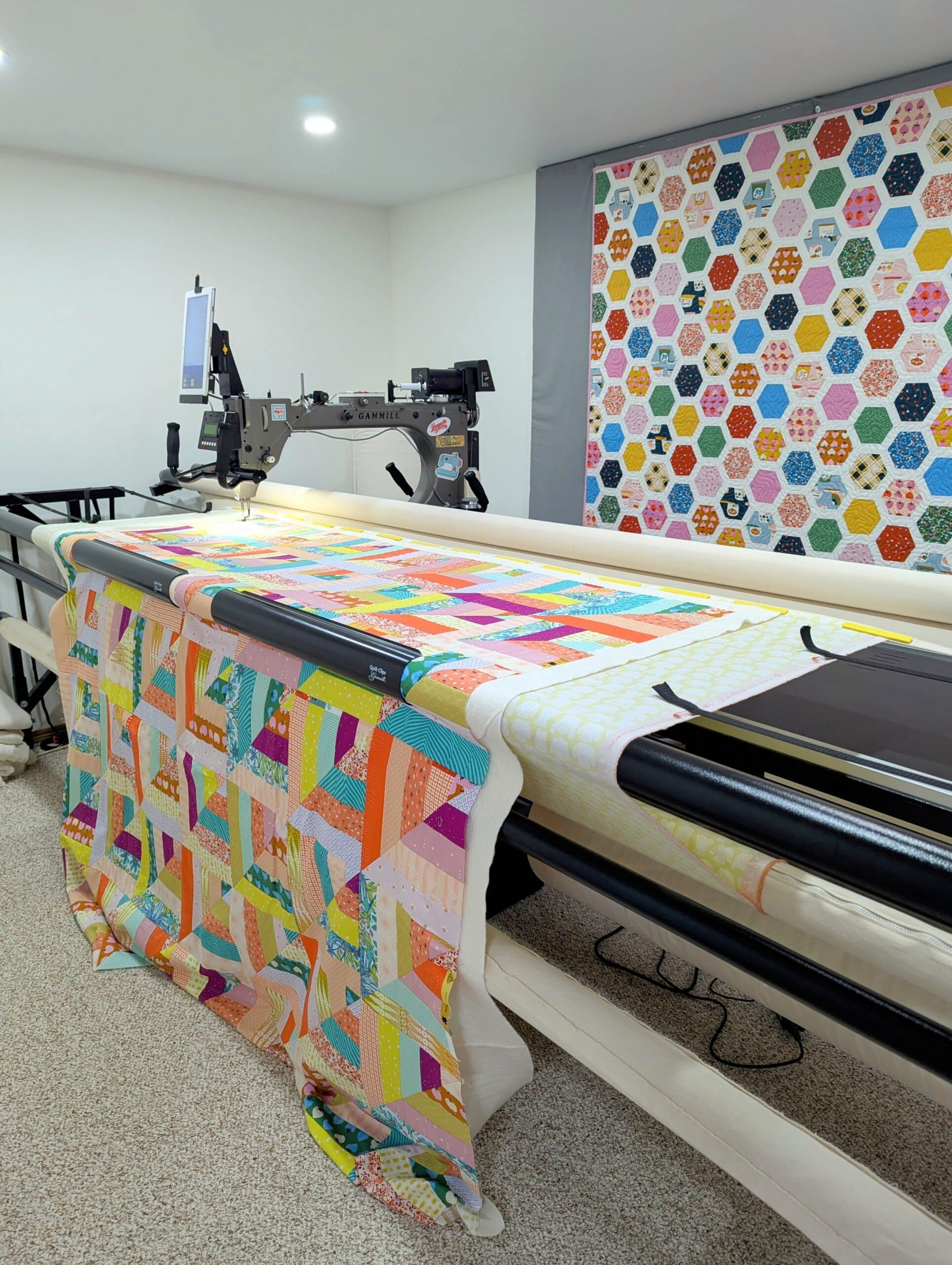 The quilt is loaded on a longarm quilting machine.