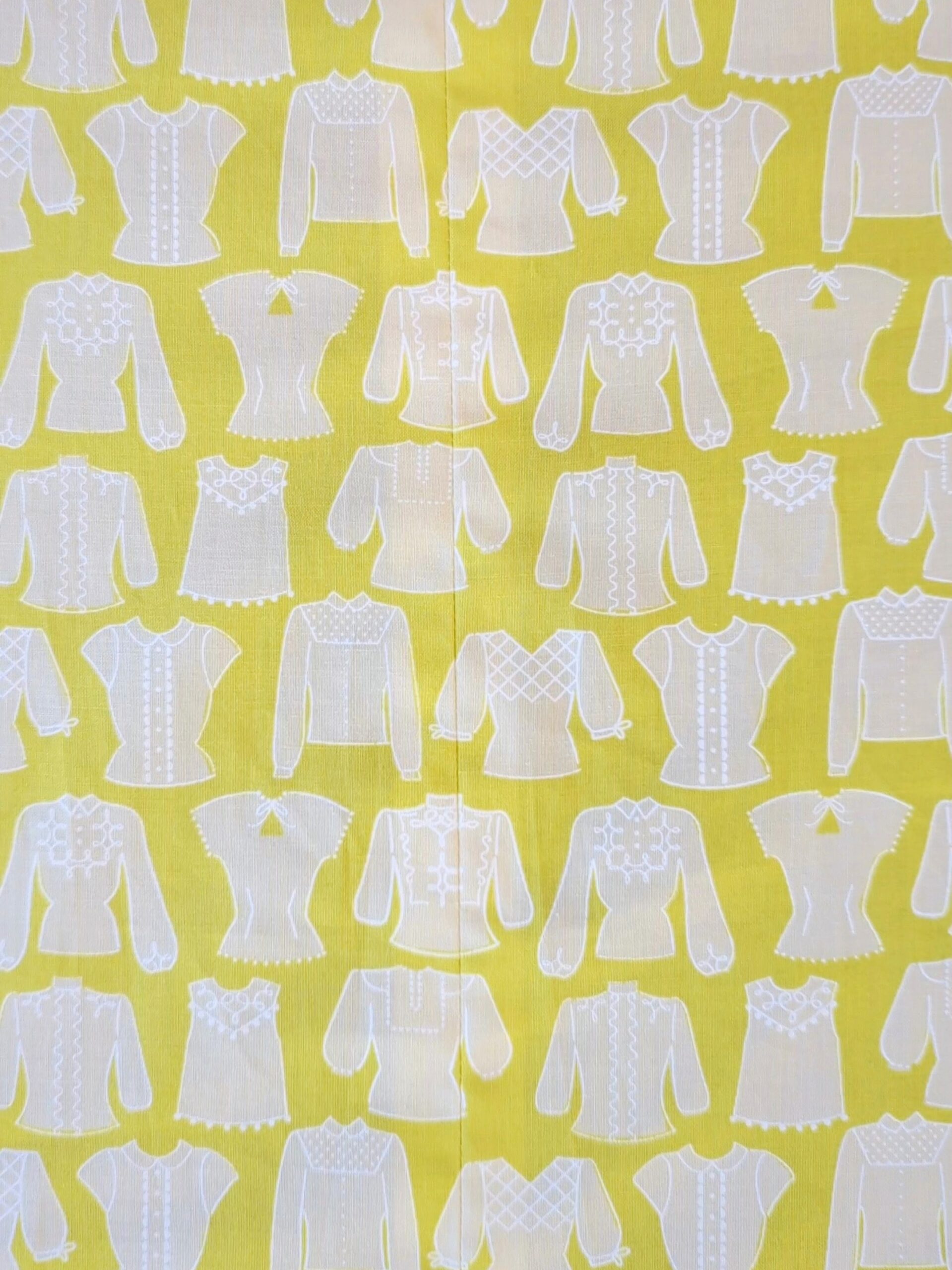 The backing fabric is shown to have a seam down the center of it, but the pattern is continuous.