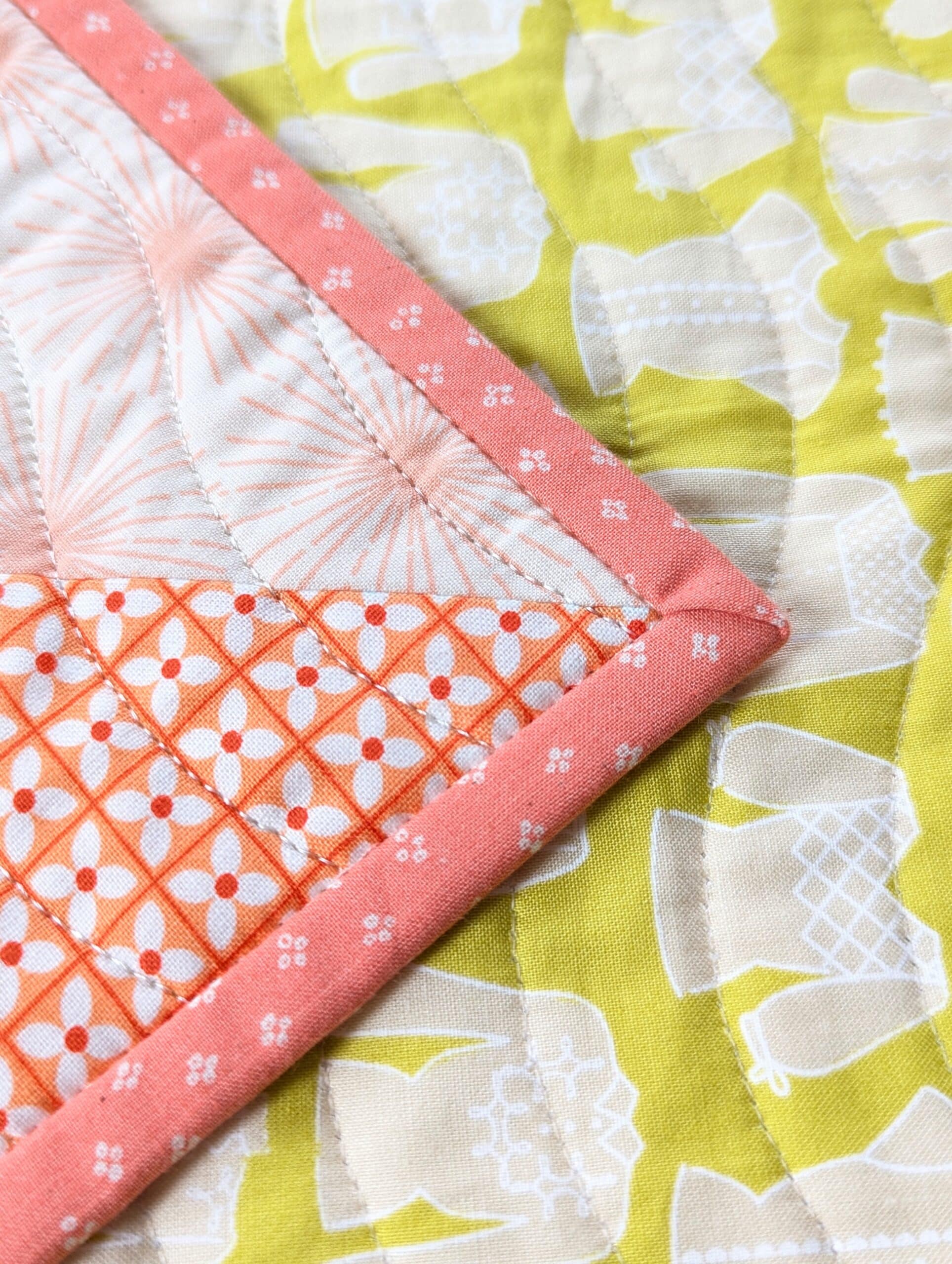 A closeup image of one corner of a quilt.