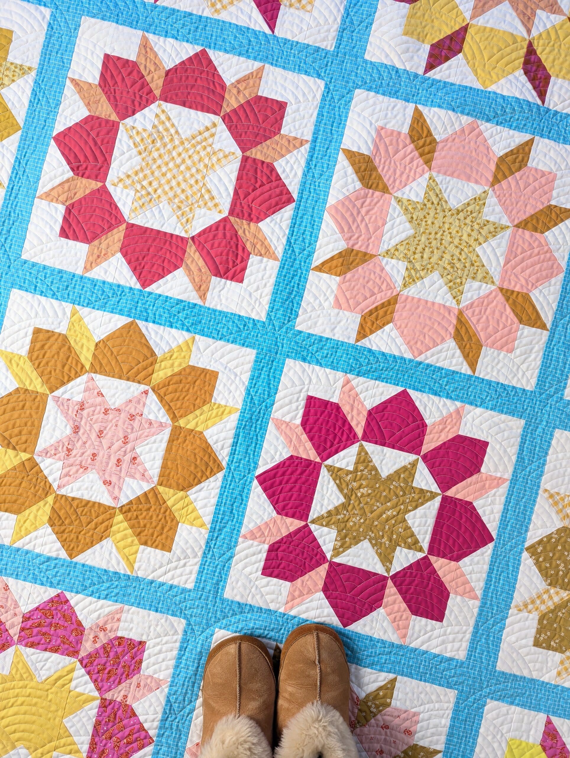 Shelly's slippers are seen standing on the quilt.