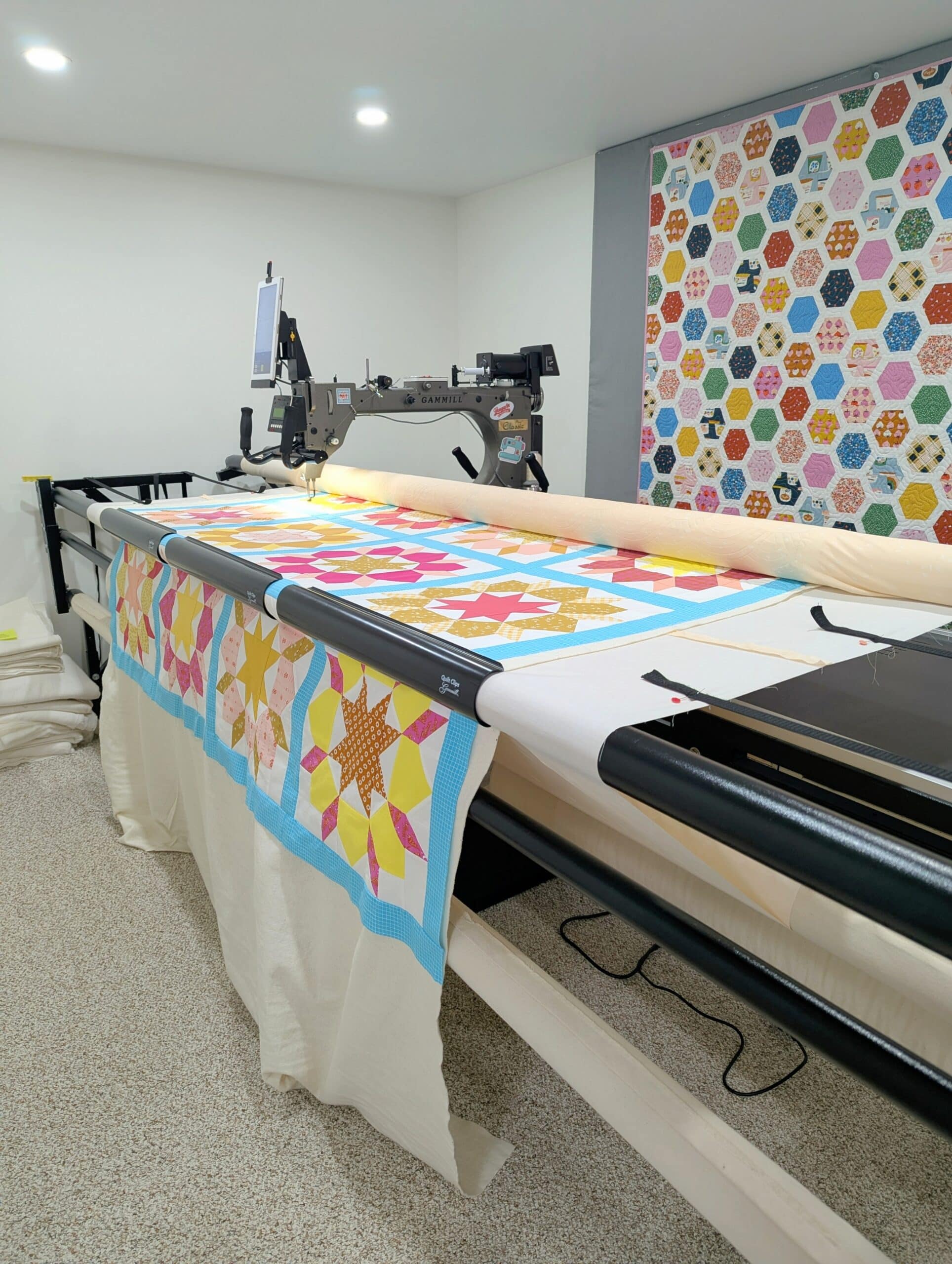 The quilt is loaded on a longarm quilting machine.